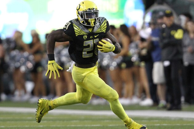 Oregon running back Royce Freeman (21) runs the ball during the second half of an NCAA college football game against Eastern Washington Saturday, Sept. 5, 2015, in Eugene, Ore. (AP Photo/Ryan Kang)