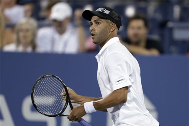 FILE - In this Aug. 28, 2013 file photo, James Blake reacts during a first round match against Ivo Karlovic, of Croatia, at the U.S. Open tennis tournament in New York.  Officials say firefighters have found three bodies in a burning mansion owned by a Blake in Tampa. Hillsborough County Sheriff’s Spokeswoman Cristal Bermudez Nunez says the home is owned by James Blake, once ranked fourth in the world. She says neighbors have told detectives that Blake hasn’t lived in the house for a while and was renting it out. She also says detectives haven’t talked with Blake yet. Blake’s agent, Carlos Fleming, says the former tennis player is not in Florida. Authorities say the fire was reported to them at 6 a.m. Firefighters were still on the scene midmorning Wednesday, May 7, 2014.(AP Photo/Darron Cummings)