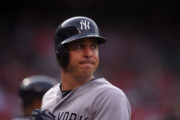 New York Yankees' Mark Teixeira walks back to the dugout after being thrown out at first during a baseball game against the Los Angeles Angels, Wednesday, July 1, 2015, in Anaheim, Calif. (AP Photo/Mark J. Terrill)