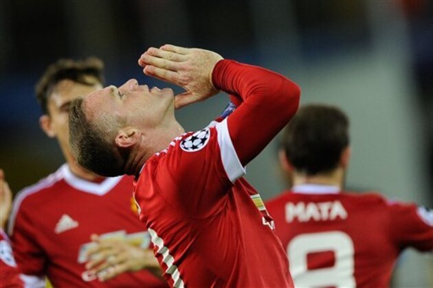 Manchester United's Wayne Rooney gestures after scoring a goal during the Champions League play-off round, second leg soccer match at  the Jan Breydel Stadium in Brugge, Belgium on Wednesday Aug. 26, 2015. (AP Photo/Laurent Dubrule)