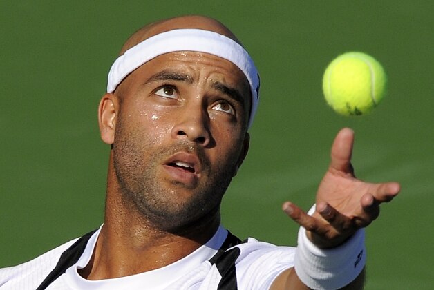 James Blake serves to Benjamin Becker, of Germany, during their match at the Farmers Classic tennis tournament, Thursday, July 29, 2010, in Los Angeles. (AP Photo/Mark J. Terrill)