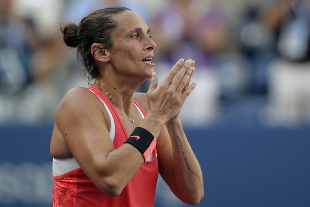 Roberta Vinci, of Italy, reacts after beating Serena Williams during a semifinal match at the U.S. Open tennis tournament, Friday, Sept. 11, 2015, in New York. (AP Photo/Bill Kostroun)