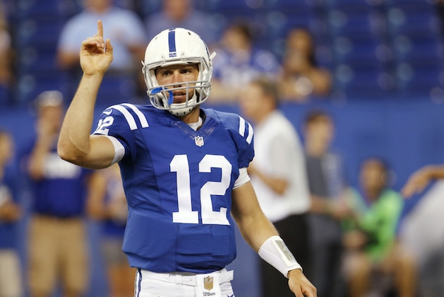 Indianapolis Colts quarterback Andrew Luck talks to teammates before the Colts' NFL preseason football game against the Cincinnati Bengals, Thursday, Sept. 3, 2015, in Indianapolis. (AP Photo/AJ Mast)