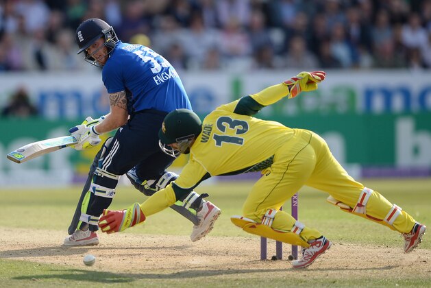 LEEDS, ENGLAND - SEPTEMBER 11:  Ben Stokes of England hits the ball past Matthew Wade of Australia during the 4th Royal London One-Day International match between England and Australia at Headingley on September 11, 2015 in Leeds, United Kingdom.  (Photo by Gareth Copley/Getty Images)