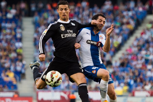 BARCELONA, SPAIN - MAY 17: Cristiano Ronaldo (L) of Real Madrid CF fights for the ball with Victor Sanchez (R) of RCD Espanyol during the La Liga match between RCD Espanyol and Real Madrid CF at Cornella-El Prat Stadium on May 17, 2015 in Barcelona, Spain. (Photo by Alex Caparros/Getty Images)