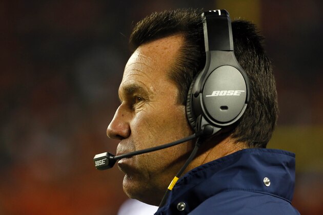 Denver Broncos head coach Gary Kubiak makes a call during the second half of an NFL preseason football game against the Arizona Cardinals, Thursday, Sept. 3, 2015, in Denver. (AP Photo/Jack Dempsey)