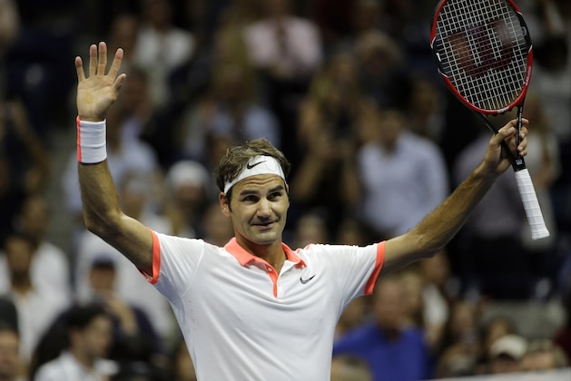 Roger Federer, of Switzerland, reacts to applause from the crowd after defeating Stan Wawrinka, of Switzerland, during a semifinal match at the U.S. Open tennis tournament, Friday, Sept. 11, 2015, in New York. (AP Photo/David Goldman)