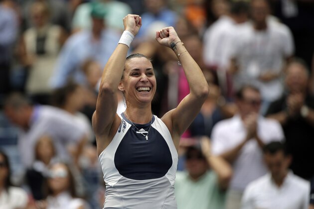 Flavia Pennetta, of Italy, reacts after winning a semifinal match against Simona Halep, of Romania, at the U.S. Open tennis tournament, Friday, Sept. 11, 2015, in New York. (AP Photo/Bill Kostroun)