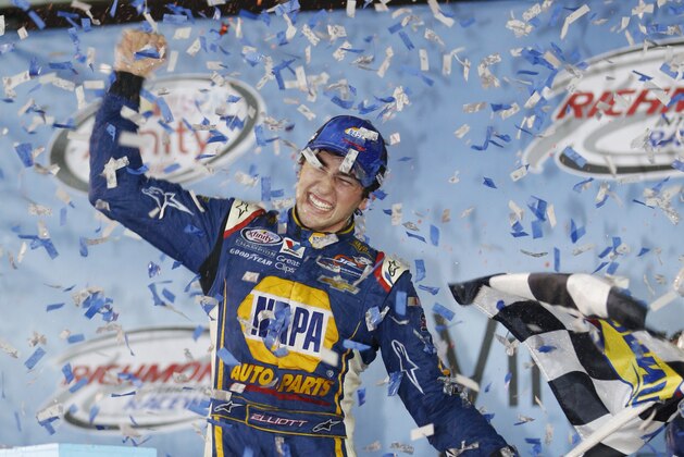 Chase Elliott celebrates winning the NASCAR Xfinity Series auto race at Richmond International Raceway in Richmond, Va., Friday, Sept. 11, 2015. (AP Photo/Steve Helber)