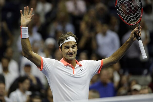 Roger Federer, of Switzerland, reacts to applause from the crowd after defeating Stan Wawrinka, of Switzerland, during a semifinal match at the U.S. Open tennis tournament, Friday, Sept. 11, 2015, in New York. (AP Photo/David Goldman)