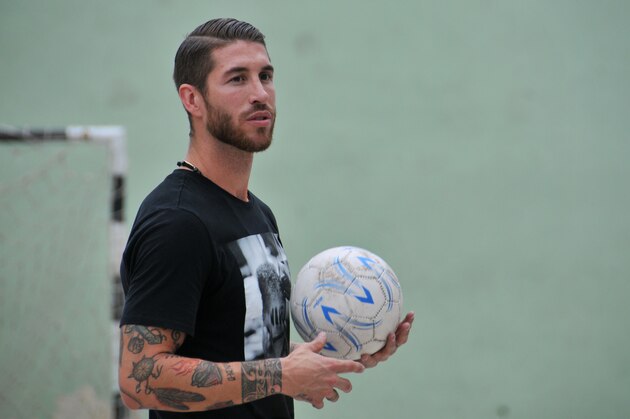 UNICEF ambassador Sergio Ramos, of Spain's national soccer team and Real Madrid holds a soccer ball during an exhibition match in Havana, Cuba, Monday, June 16, 2015.  (AP Photo/Ladyrene Perez, Cubadebate)