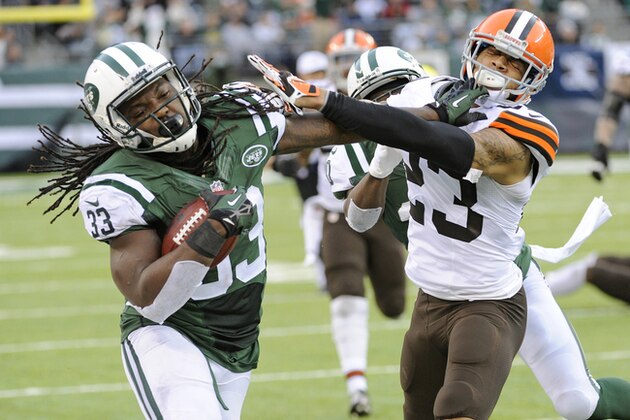 New York Jets running back Chris Ivory (33) stiff-arms Cleveland Browns' Joe Haden (23) during the second half of an NFL football game Sunday, Dec. 22, 2013, in East Rutherford, N.J. (AP Photo/Bill Kostroun)