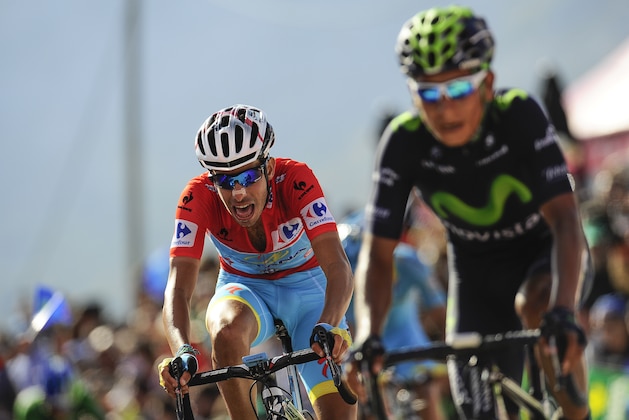 Astana's Team Fabio Aru, of Italy, left,  crosses the finish line beside Movistar's Team Nairo Quintana, of Colombia, at the end of the 145th stage between Comillas and Sotres Cabrales, 175,8 kilometers (109 miles),  of the Spanish Vuelta cycling race that finish in Sotres Cabrales, northern Spain, Sunday, Sept. 6, 2015.  Joaquin Rodriguez won the stage. (AP Photo/Alvaro Barrientos)