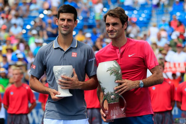 CINCINNATI, OH - AUGUST 23: Roger Federer of Switzerland (R) and Novak Djokovic of Serbia pose with the trophies after Federer won in two sets to win the mens singles final at the Western & Southern Open at the Linder Family Tennis Center on August 23, 2015 in Cincinnati, Ohio. (Photo by Rob Carr/Getty Images) CINCINNATI, OH - AUGUST 23: Roger Federer of Switzerland (R) and Novak Djokovic of Serbia pose with the trophies after Federer won in two sets to win the mens singles final at the Western & Southern Open at the Linder Family Tennis Center on August 23, 2015 in Cincinnati, Ohio. (Photo by Rob Carr/Getty Images)