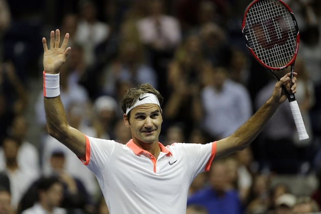 Roger Federer, of Switzerland, reacts to applause from the crowd after defeating Stan Wawrinka, of Switzerland, during a semifinal match at the U.S. Open tennis tournament, Friday, Sept. 11, 2015, in New York. (AP Photo/David Goldman)