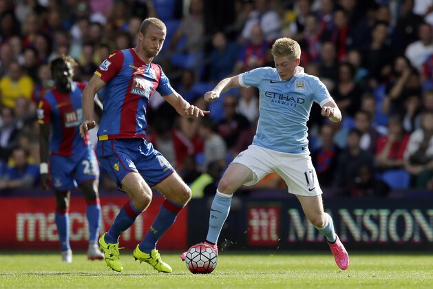 Crystal Palace’s Brede Hangeland, left, competes for the ball with Manchester City’s Kevin De Bruyne during the English Premier League soccer match between Crystal Palace and Manchester City at Selhurst Park, London, Saturday, Sept. 12, 2015. (AP Photo/Tim Ireland)