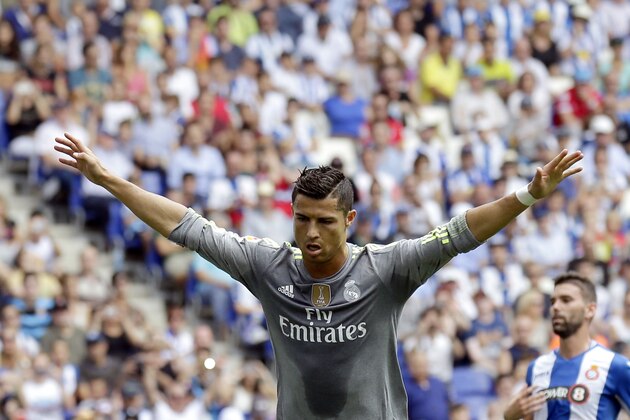 Real Madrid's Cristiano Ronaldo celebrates after scoring against Espanyol during a Spanish La Liga soccer match  at Cornella-El Prat stadium in Cornella Llobregat, Spain, Saturday, Sept. 12, 2015. (AP Photo/Manu Fernandez)