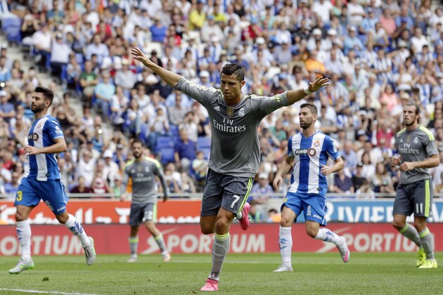 Real Madrid's Cristiano Ronaldo celebrates after scoring against Espanyol during a Spanish La Liga soccer match  at Cornella-El Prat stadium in Cornella Llobregat, Spain, Saturday, Sept. 12, 2015. (AP Photo/Manu Fernandez)