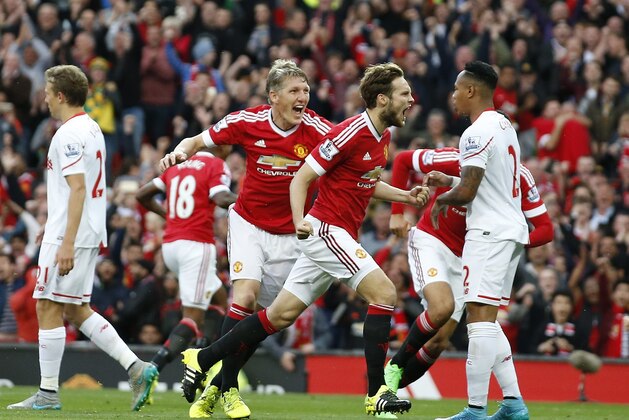 Manchester United's Daley Blind, centre, celebrates after scoring the opening goal during the English Premier League soccer match between Manchester United and Liverpool at Old Trafford Stadium, Manchester, England, Saturday, Sept. 12, 2015. (AP Photo/Jon Super) Manchester United's Daley Blind, centre, celebrates after scoring the opening goal during the English Premier League soccer match between Manchester United and Liverpool at Old Trafford Stadium, Manchester, England, Saturday, Sept. 12, 2015. (AP Photo/Jon Super)