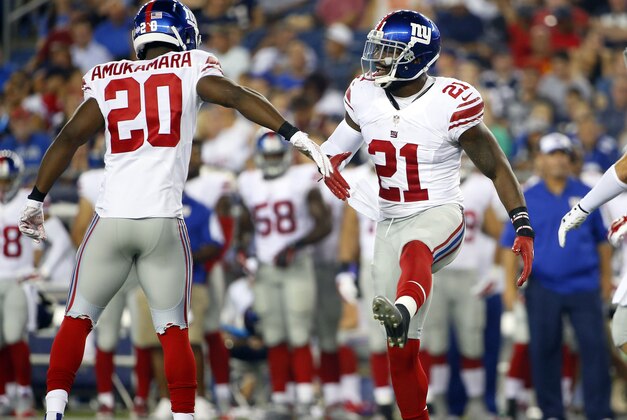New York Giants strong safety Landon Collins (21) and cornerback Prince Amukamara celebrate in the first half of an NFL football game against the New England Patriots Thursday, Sept. 3, 2015, in Foxborough, Mass. (AP Photo/Winslow Townson)
