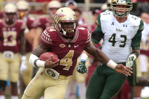 Florida State's Dalvin Cook, center, scampers 74 yards for a touchdown against South Florida during the first quarter of an NCAA college football game, Saturday, Sept. 12, 2015, in Tallahassee, Fla. (AP Photo/Steve Cannon)