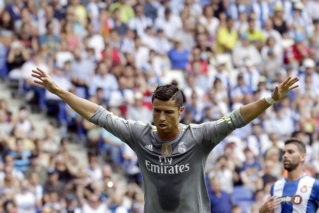 Real Madrid's Cristiano Ronaldo celebrates after scoring against Espanyol during a Spanish La Liga soccer match  at Cornella-El Prat stadium in Cornella Llobregat, Spain, Saturday, Sept. 12, 2015. (AP Photo/Manu Fernandez)