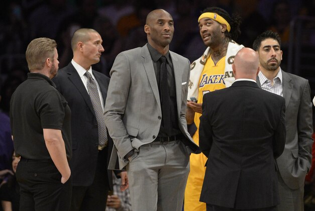 Mar 12, 2015; Los Angeles, CA, USA; Los Angeles Lakers injured player Kobe Bryant (middle) in the first half during the game against the New York Knicks at Staples Center. Mandatory Credit: Richard Mackson-USA TODAY Sports Mar 12, 2015; Los Angeles, CA, USA; Los Angeles Lakers injured player Kobe Bryant (middle) in the first half during the game against the New York Knicks at Staples Center. Mandatory Credit: Richard Mackson-USA TODAY Sports