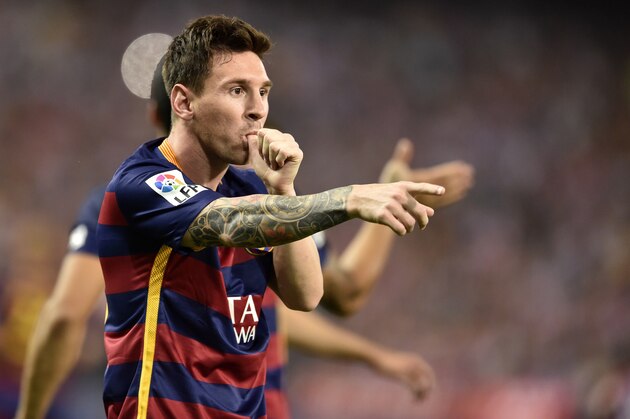 Barcelona's Argentinian forward Lionel Messi celebrates after scoring during the Spanish league football match Club Atletico de Madrid vs FC Barcelona at the Vicente Calderon stadium in Madrid on September 12, 2015.   AFP PHOTO/ GERARD JULIEN        (Photo credit should read GERARD JULIEN/AFP/Getty Images)
