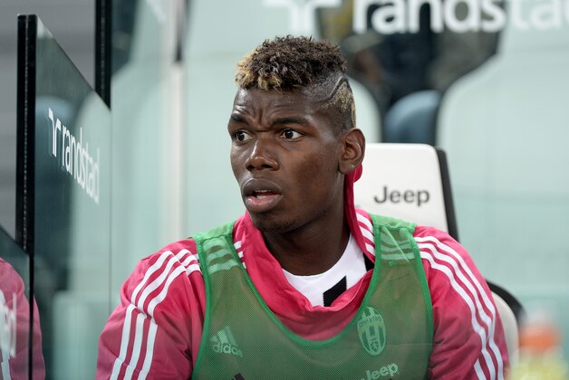 Juventus' Paul Pogba sits on the bench during a Serie A soccer match between Juventus and Chievo Verona at the Juventus Stadium, in Turin, Italy, Saturday, Sept. 12, 2015. (AP Photo/Massimo Pinca)