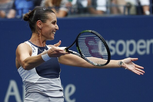 Flavia Pennetta, of Italy, reacts after beating Roberta Vinci, of Italy, during the women's championship match of the U.S. Open tennis tournament, Saturday, Sept. 12, 2015, in New York. (AP Photo/Julio Cortez)