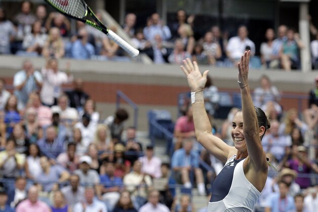 Flavia Pennetta, of Italy, celebrates after beating Roberta Vinci, of Italy, during the women's championship match of the U.S. Open tennis tournament, Saturday, Sept. 12, 2015, in New York. (AP Photo/Peter Morgan)
