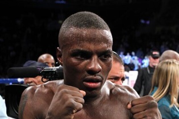 New York's Peter Quillin poses with the championship belt after winning his WBO middleweight title bout against Hassan N'Dam, of France, at the Barclays Center, Saturday, Oct. 20, 2012, in New York. Quillin won the bout by unanimous decision. (AP Photo/Jason DeCrow)