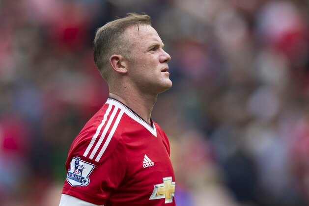 Manchester United's Wayne Rooney walks from the pitch after his team's scoreless draw in the English Premier League soccer match between Manchester United and Newcastle at Old Trafford Stadium, Manchester, England, Saturday, Aug. 22, 2015. (AP Photo/Jon Super)