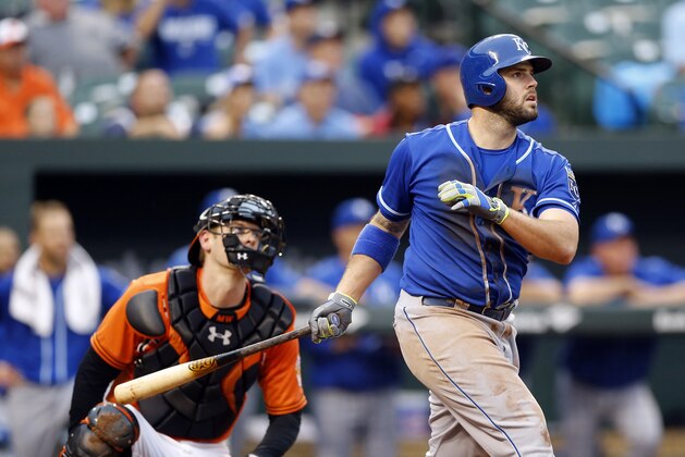Kansas City Royals' Mike Moustakas, right, watches his grand slam in front of Baltimore Orioles catcher Matt Wieters in the seventh  inning of a baseball game, Saturday, Sept. 12, 2015, in Baltimore. (AP Photo/Patrick Semansky)