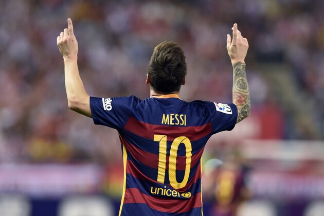 Barcelona's Argentinian forward Lionel Messi celebrates after scoring during the Spanish league football match Club Atletico de Madrid vs FC Barcelona at the Vicente Calderon stadium in Madrid on September 12, 2015.   AFP PHOTO/ GERARD JULIEN        (Photo credit should read GERARD JULIEN/AFP/Getty Images)