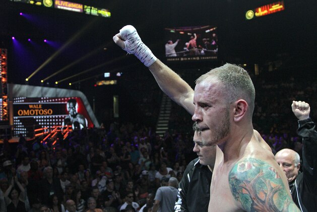 Sammy Vasquez, celebrates after winning a unanimous decision over Wale Omotoso, of Nigeria, in their Welterweight 10 round fight, Sunday, June 21, 2015 at the MGM Grand Garden Arena in Las Vegas, NV.  (AP Photo/John Gurzinski)