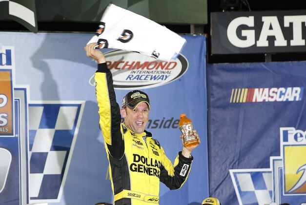 Sep 12, 2015; Richmond, VA, USA; Sprint Cup Series driver Matt Kenseth (20) celebrates in Victory Lane after winning the Federated Auto Parts 400 at Richmond International Raceway. Mandatory Credit: Amber Searls-USA TODAY Sports