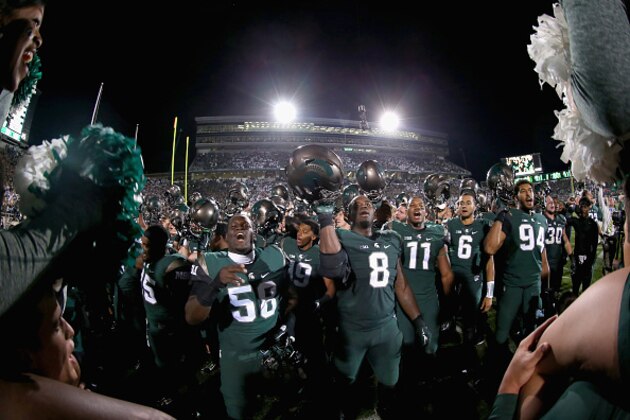 EAST LANSING, MI - SEPTEMBER 12:  The Michigan State Spartans react after defeating the Oregon Ducks 31-28 at Spartan Stadium on September 12, 2015 in East Lansing, Michigan.  (Photo by Streeter Lecka/Getty Images)