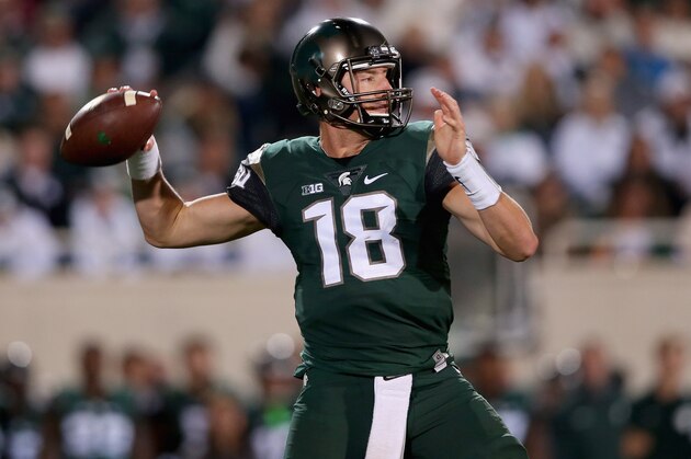 EAST LANSING, MI - SEPTEMBER 12:  Connor Cook #18 of the Michigan State Spartans drops back to pass against the Oregon Ducks during their game at Spartan Stadium on September 12, 2015 in East Lansing, Michigan.  (Photo by Streeter Lecka/Getty Images)