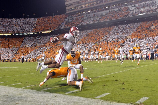 KNOXVILLE, TN - SEPTEMBER 12: Wide receiver Sterling Shepard #3 of the Oklahoma Sooners jumps over safety Brian Randolph #37 of the Tennessee Volunteers and past cornerback Malik Foreman #13 on the game-winning touchdown in overtime at Neyland Stadium on September 12, 2015 in Knoxville, Tennessee. (Photo by Jackson Laizure/Getty Images)