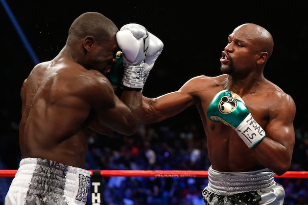 LAS VEGAS, NV - SEPTEMBER 12:  Floyd Mayweather Jr. throws a right at Andre Berto during their WBC/WBA welterweight title fight at MGM Grand Garden Arena on September 12, 2015 in Las Vegas, Nevada.  (Photo by Ezra Shaw/Getty Images)