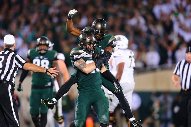 EAST LANSING, MI - SEPTEMBER 12:  Chris Frey #23 of the Michigan State Spartans reacts after sacking Vernon Adams Jr. #3 of the Oregon Ducks at Spartan Stadium on September 12, 2015 in East Lansing, Michigan. (Photo by Rey Del Rio/Getty Images)
