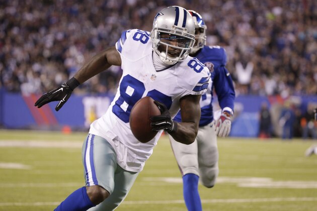 Dallas Cowboys wide receiver Dez Bryant (88) takes the ball to the end zone for a touchdown against the New York Giants in the third quarter of an NFL football game, Sunday, Nov. 23, 2014, in East Rutherford, N.J. (AP Photo/Julio Cortez)