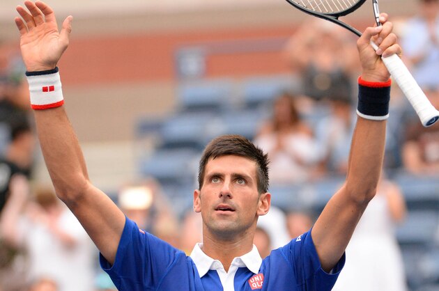 Aug 31, 2015; New York, NY, USA; Novak Djokovic of Serbia celebrates after beating  Joao Souza of Brazil 6-1, 6-1, 6-1 on day one of the 2015 US Open at USTA Billie Jean King National Tennis Center. Mandatory Credit: Robert Deutsch-USA TODAY Sports
