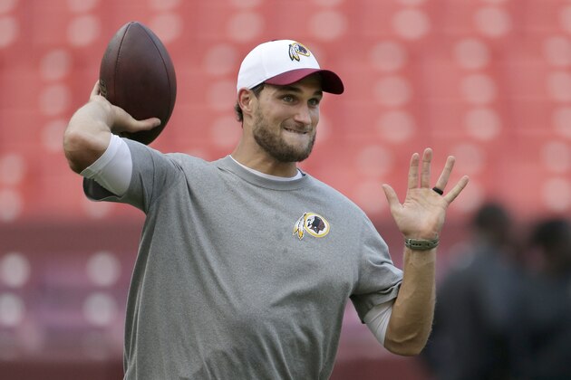 Washington Redskins quarterback Kirk Cousins (8) warms up before an NFL preseason football game against the Jacksonville Jaguars in Landover, Md., Thursday, Sept. 3, 2015. (AP Photo/Mark Tenally)