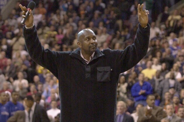 Former Philadelphia 76ers great Moses Malone reacts as the crowd gives him a standing ovation during the 76ers game against the Memphis Grizzlies, Sunday, Dec. 2, 2001, in Philadelphia. Malone was given recognition for his induction into the Basketball Hall of Fame.   (AP Photo/Chris Gardner)