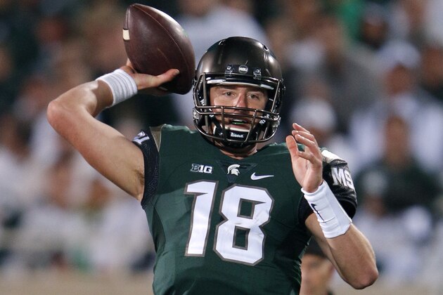 Michigan State quarterback Connor Cook throws a pass against Oregon during the third quarter of an NCAA college football game, Saturday, Sept. 12, 2015, in East Lansing, Mich. Michigan State won 31-28. (AP Photo/Al Goldis)