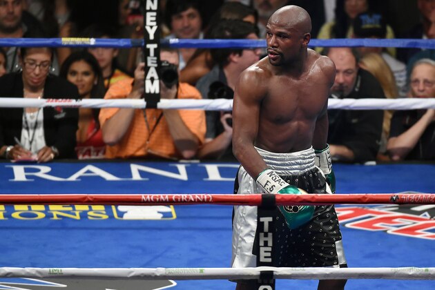 LAS VEGAS, NV - SEPTEMBER 12:  Floyd Mayweather Jr. looks back at Andre Berto's corner after the sixth round of their WBC/WBA welterweight title fight at MGM Grand Garden Arena on September 12, 2015 in Las Vegas, Nevada. Mayweather retained his titles with a unanimous-decision victory.  (Photo by Ethan Miller/Getty Images)