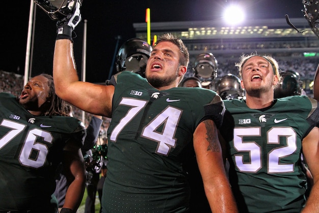 Sep 12, 2015; East Lansing, MI, USA; Michigan State Spartans offensive tackle Jack Conklin (74) celebrates the win over the Oregon Ducks after a game at Spartan Stadium. MSU won 31-28. Mandatory Credit: Mike Carter-USA TODAY Sports