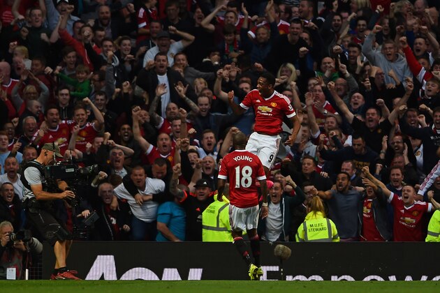 MANCHESTER, ENGLAND - SEPTEMBER 12:  Anthony Martial of Manchester United celebrates scoring his team's third goal with Ashley Young during the Barclays Premier League match between Manchester United and Liverpool at Old Trafford on September 12, 2015 in Manchester, United Kingdom.  (Photo by Laurence Griffiths/Getty Images)